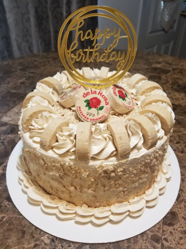 a birthday cake with frosting and decorations on top