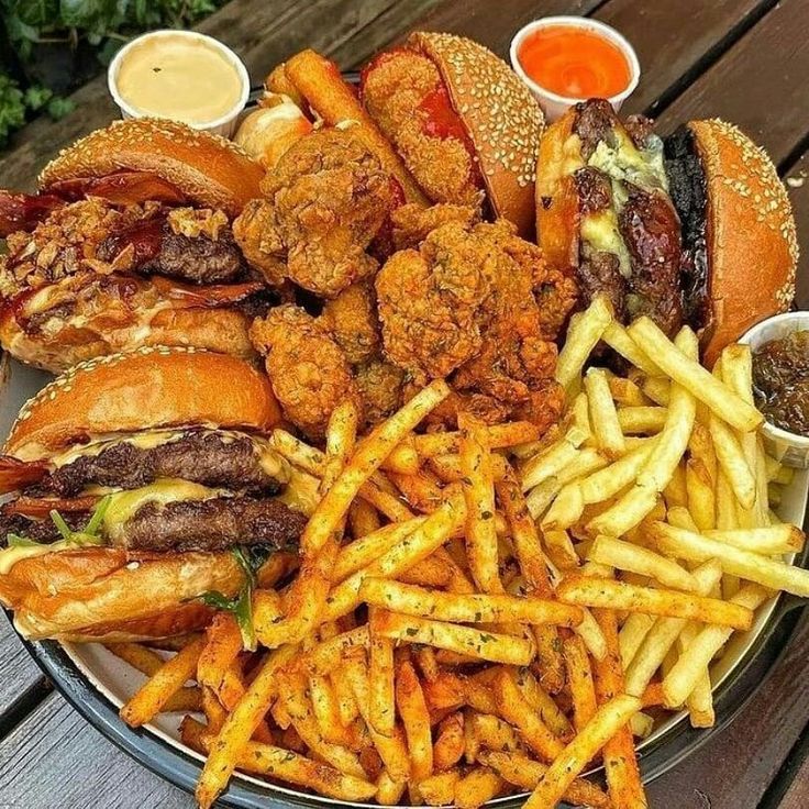 a plate full of burgers and french fries