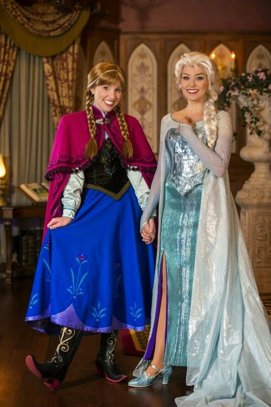 two women dressed as disney and frozen princesses