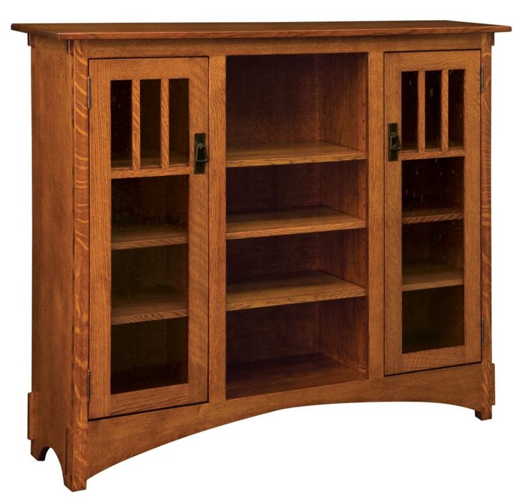 an oak bookcase with glass doors and shelves on the front, is shown in this image