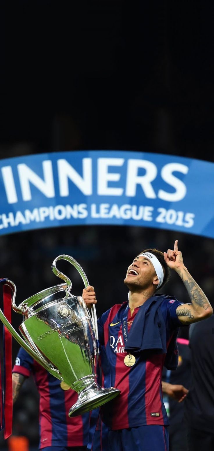 barcelona's forward neymil celebrates with the trophy