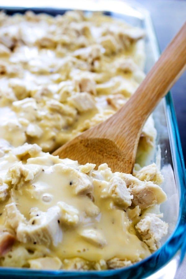 a casserole dish with chicken and gravy in it, ready to be eaten