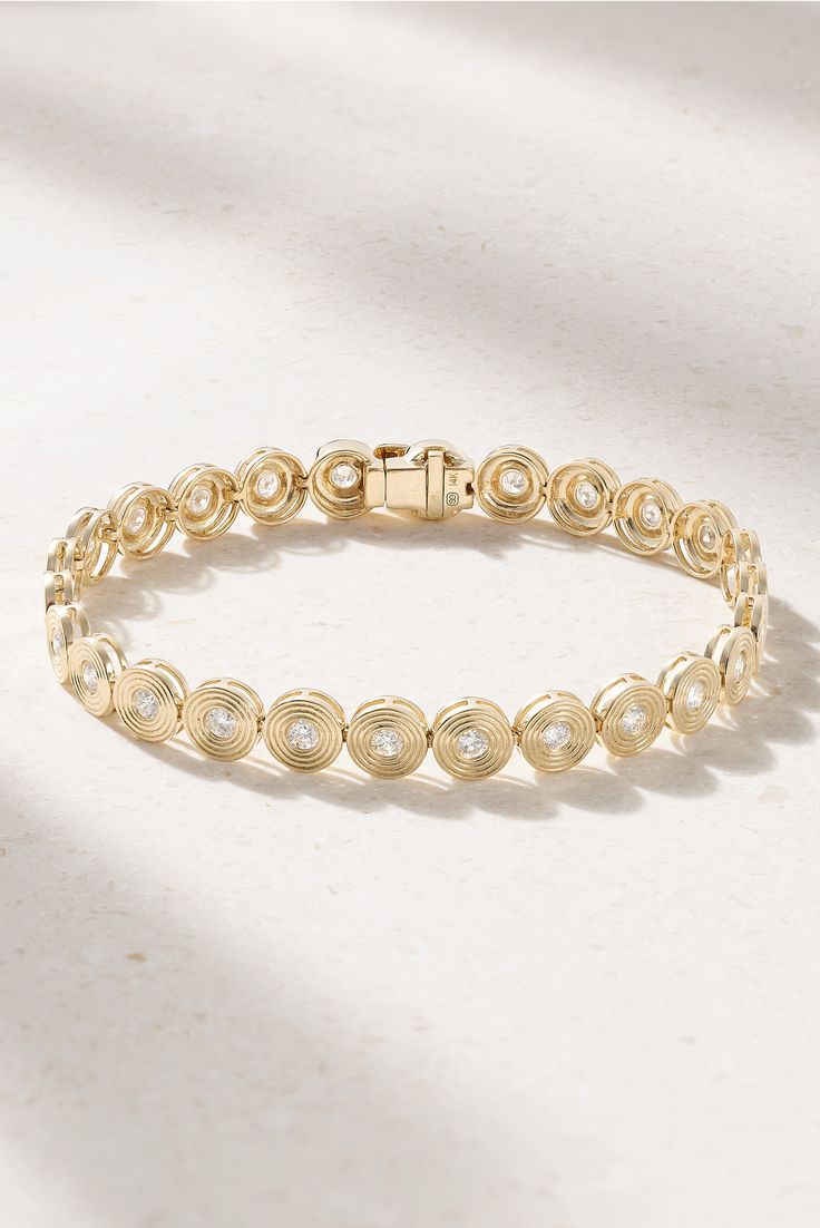 Sydney Evan’s bracelet is a modern take on classic tennis style. It's cast from 14-karat gold carved circle charms centered with tiny diamonds. Wear it solo or stacked with similar dainty pieces. Round Cubic Zirconia Diamond Bracelet, Round Cubic Zirconia Diamond Bracelet With Polished Finish, 14k Gold Bracelet With Diamond Accents, Diamond Bracelet With Polished Finish, Modern Yellow Gold Round Diamond Bracelet, Elegant Yellow Gold Tennis Bracelet With Bezel Setting, Yellow Gold Diamond Tennis Bracelet With Bezel Setting, Modern Yellow Gold Diamond Bracelet With Bezel Setting, Polished Diamond Tennis Bracelet