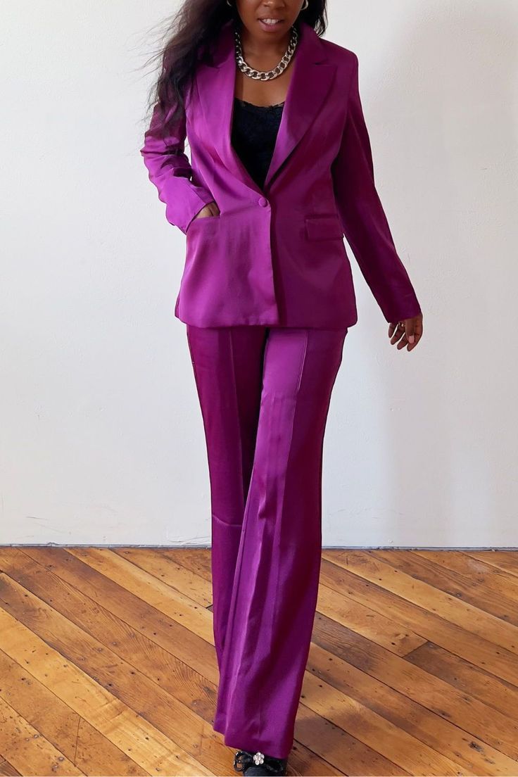 Stand apart in this classy pantsuits for women. Designed for the classy and feminine woman, this elegant purple pantsuit suits offer a perfect blend of sophistication and style. Whether you're attending a classy wedding or looking for an evening out, this pantsuits is tailored to perfection, ensuring you make a memorable impression. Dive into our collection of classy wedding guest outfits and shop for the perfect pantsuit that will make you stand out in any crowd Formal Silk Blazer With Pockets, Silk Blazer With Pockets For Formal Occasions, Silk Blazer With Pressed Crease For Office, Silk Office Blazer With Pressed Crease, Silk Blazer With Notch Lapel And Pockets, Tailored Satin Blazer For Semi-formal Occasions, Silk Suits For Fall Workwear, Silk Suits For Workwear In Fall, Tailored Silk Blazer For Work