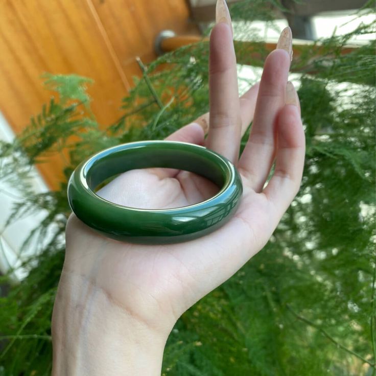 △ Handmade
△ Jade
△ Inside Diameter: 51mm-64mm
△ Gemstones are 100% genuine
△ The bangle is solid and significant. It is smooth and solid on your wrist.

“This jade bangle is breathtaking. It is slightly transparent with a pattern visible inside. The color is like in the photo, calming dark green. The fit is so comfortable.”-Julianne

All stones are unique and may vary from the one shown in the picture. Each jade bangle is handmade for you and comes packaged in a beautiful gift box.  Your purcha Glass Bangles, Bangles Making, Jade Bangle, Good Luck To You, Bring Good Luck, Green Crystal, Dream Jewelry, Green Crystals, Beautiful Gift Boxes