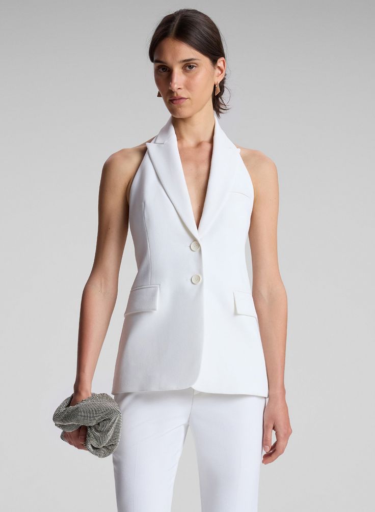 woman wearing white vest and white pants Summer Formal Pantsuit With Notch Lapel, Formal Summer Pantsuit With Notch Lapel, Tailored Summer Evening Blazer, Tailored Evening Blazer For Summer, Chic Structured Pantsuit For Tailoring, Chic Summer Pantsuit With Notch Lapel, Elegant Sleeveless Summer Blazer, Elegant Tailored Summer Pantsuit, Chic Summer Formal Suits