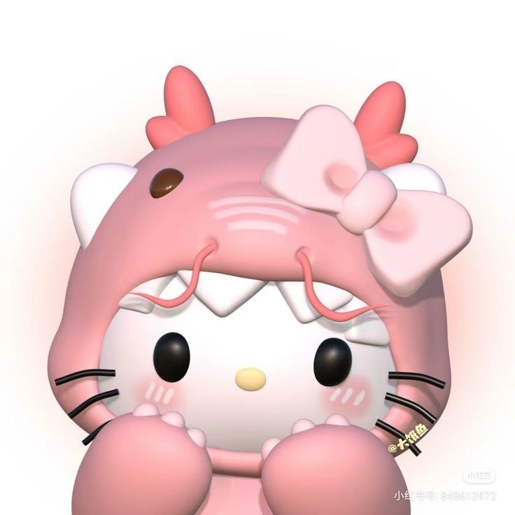 a pink hello kitty doll sitting on top of a white surface