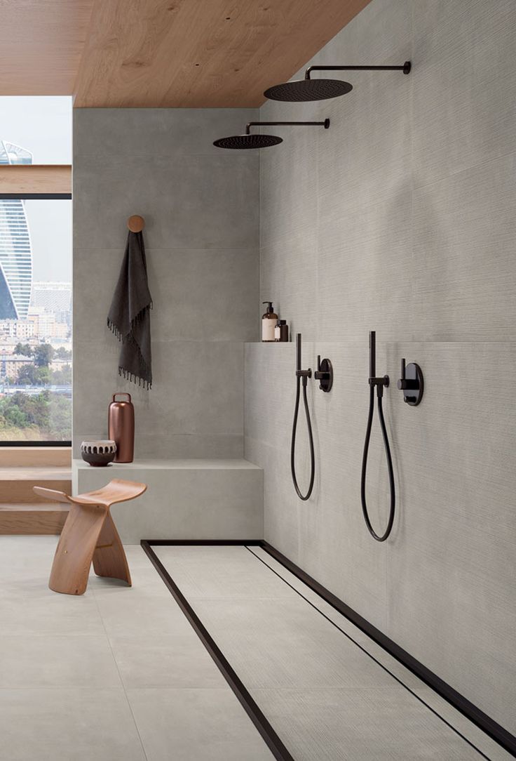 a bathroom with a bench and shower head