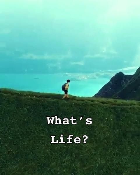 a man running up a hill with the words what's life?