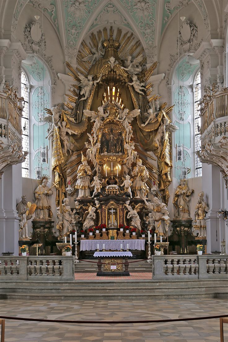 an ornate church with gold and white decorations