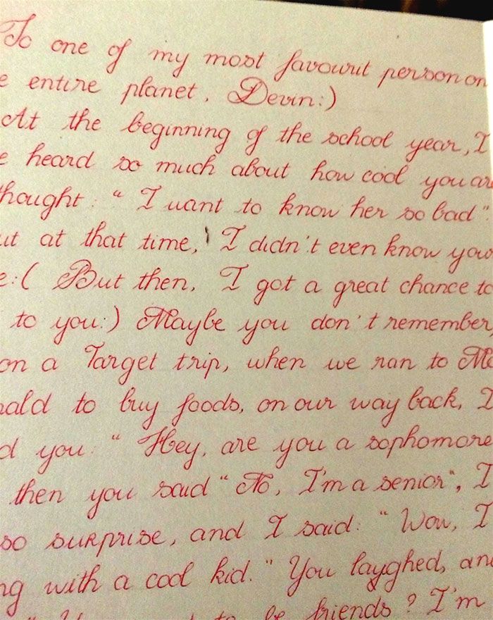 an old handwritten letter is shown in red ink