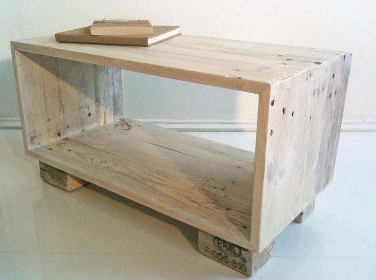 a small wooden table with a book on it's top and bottom shelf, made out of wood planks