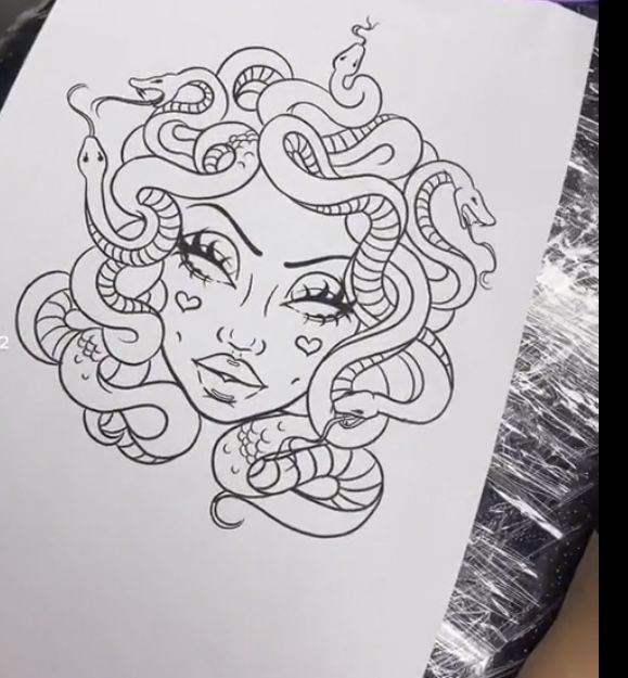 a drawing of a woman's face with snakes around her head and eyes on paper