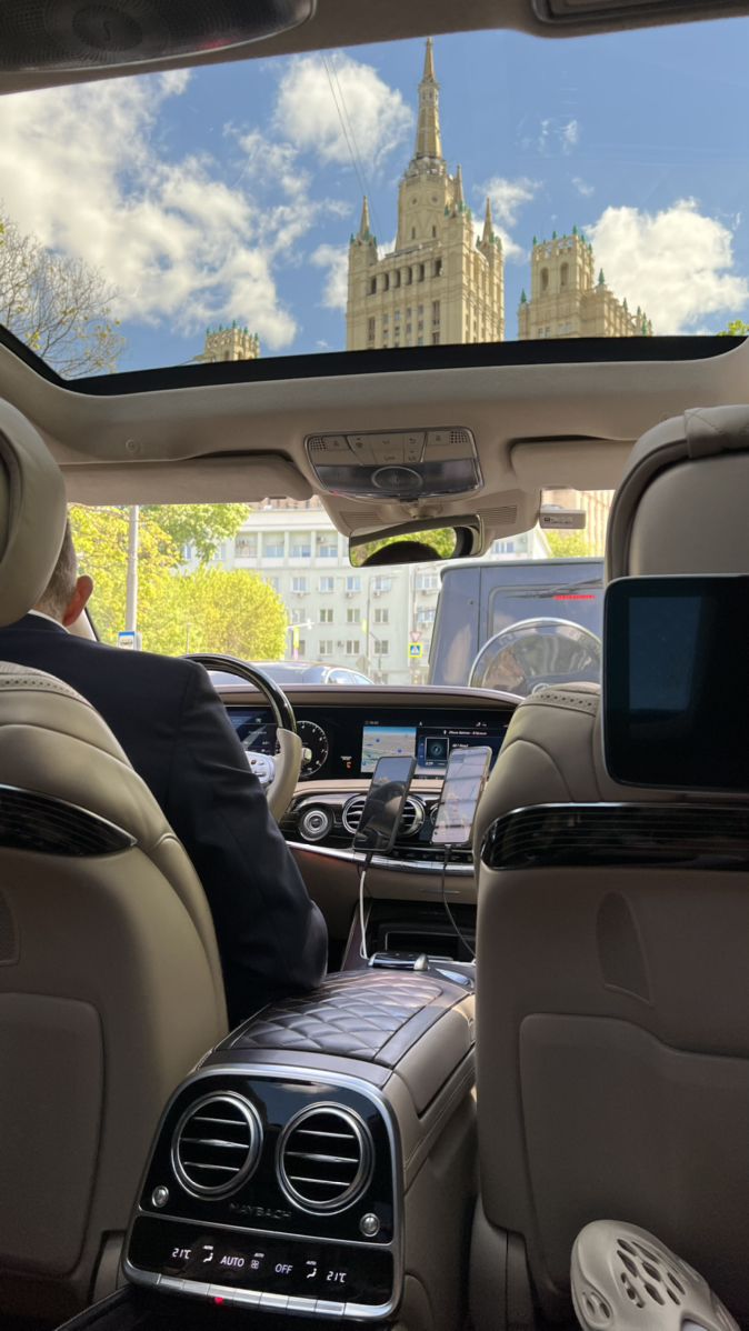 a man sitting in the back seat of a car