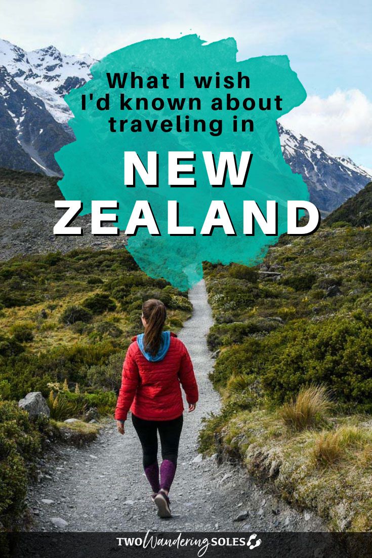 a woman walking down a trail with the words what i wish i'd known about traveling in new zealand