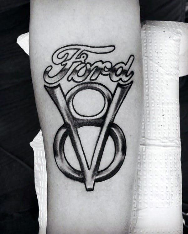 a black and white photo of a tattoo with the word's logo on it