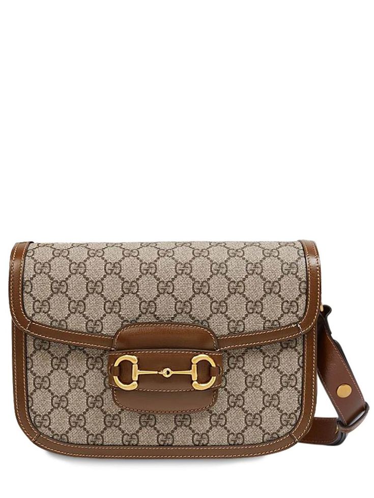 Height: 18cm Width: 25cm Depth: 8cm. Shoulder strap drop: 45cm. Adjustable shoulder strap. Flap closure. Leather details. All over logo pattern placement may vary. Gold colored metal hardware. Three internal compartments. One internal zip pocket. One internal pocket Versace Brand, Ski Accessories, Leather Bag Women, Logo Pattern, Sports Accessories, Swim Accessories, Heeled Loafers, Branded Bags, Metal Hardware