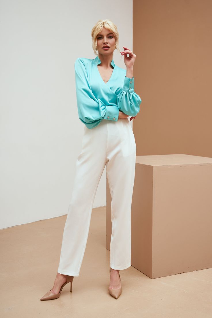 Fabric: Silk Cotton 50%, Polyester 50% Mandarin collar blouse V-neck Puff sleeves Long sleeves Button on sleeves detail Blouse length: 62 cm/ 24,4 in Sleeve length: 69 cm/ 27,1 in Colors: Tiffany-Blue, Black, Dusty Pink Elegant Puff Sleeve Button-up Top, V-neck Blouson Sleeve Work Tops, Fall V-neck Puff Sleeve Top With Blouson Sleeves, Summer V-neck Blouse With Button Cuffs, Chic Button-up Puff Sleeve Top For Fall, Chic V-neck Blouse With Gathered Sleeves, Chic V-neck Padded Blouse, Chic Padded V-neck Blouse, Spring Office Wear V-neck Blouse