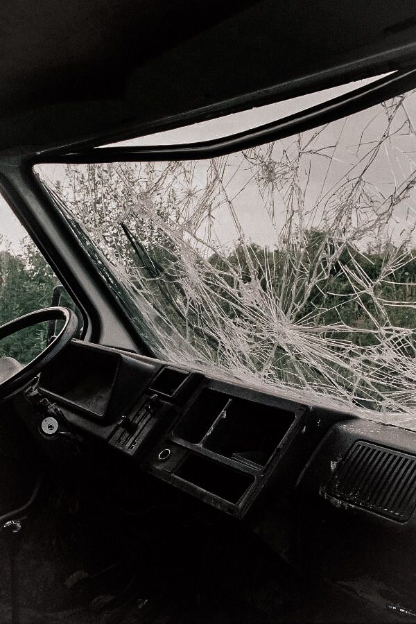 the interior of a vehicle with broken windshield