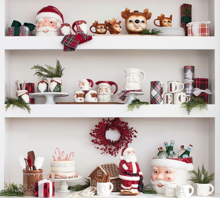 shelves with christmas decorations and figurines on them