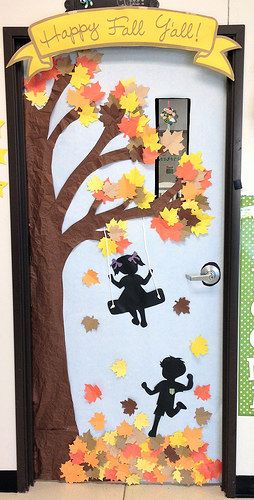 a door decorated with fall leaves and the words happy fall y'all