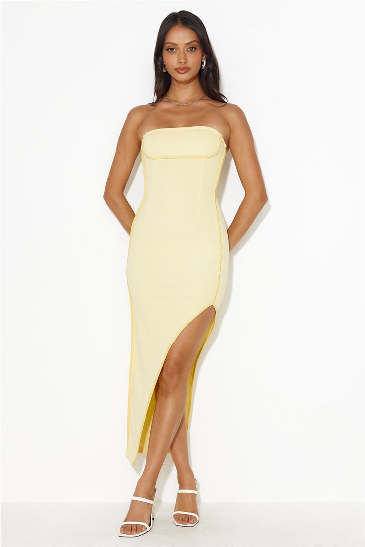 Length from bust to hem of size S: 135cm Chest 36cm, Waist 29cm, size S. Midi dress. Semi-lined. Model is a standard XS and is wearing size XS. True to size. Stretch. Strapless. Asymmetrical skirt. Yellow trimming. Split. Zipper. Cold hand wash only. Polyester/Spandex. Level up your 'fit with the Casino Queen Midi Dress. Featuring an asymmetrical skirt and yellow trimming. Style with heels to have all the attention on you.