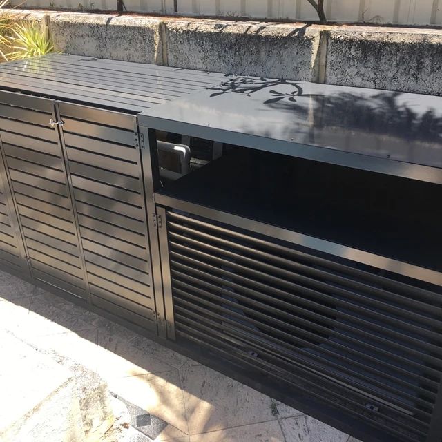 a large metal cabinet sitting on top of a sidewalk