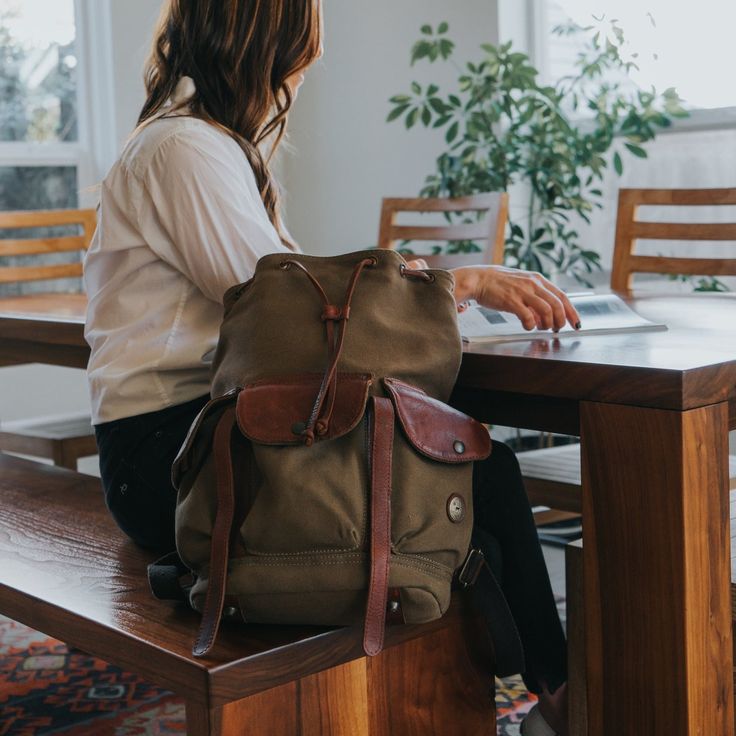 Built to travel with you everyday, with tons of space and a padded back, our rugged Lennon Backpack is comfortable and sturdy enough to tag along no matter where you are headed. Equally as suited for the office as it is for the trail. Constructed from full grain vegetable tanned leather and 18 oz 100% cotton canvas the bag is built to last and will only get better with age. Dimensions: 12” x 16” x 8.5” Weight: Approx. 4 lbs Full-grain vegetable-tanned leather & 18 oz. cotton canvas Interior lapt Classic Everyday Backpack With Waxed Finish, Everyday Rugged Bag With Leather Patch, Waxed Finish Satchel Backpack For Everyday, Everyday Waxed Satchel Backpack, Everyday Waxed Finish Satchel Backpack, Classic Leather Backpack With Leather Backing For Outdoor, Rugged Everyday Backpack, Everyday Rugged Standard Backpack, Leather Backpack With Leather Trim For Daily Use