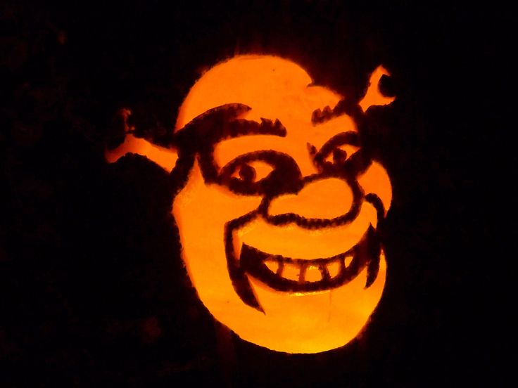 a carved pumpkin with an evil face on it