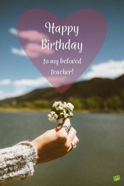 someone holding a flower in their hand with the words happy birthday to my beloved teacher