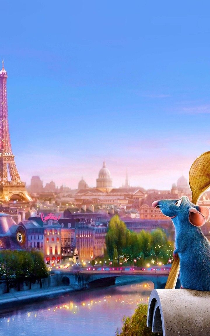 two mice sitting on top of a mailbox in front of the eiffel tower