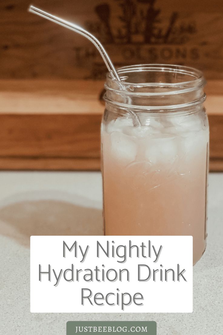 a mason jar filled with ice and water next to a wooden box that says, my nightly hydration drink recipe