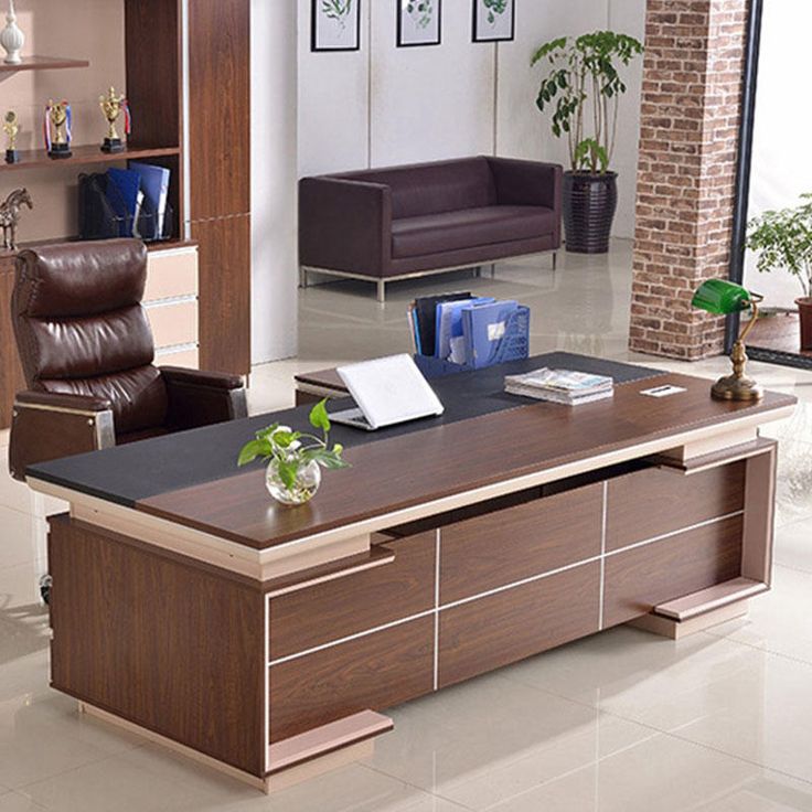 an office with a desk and chairs in it