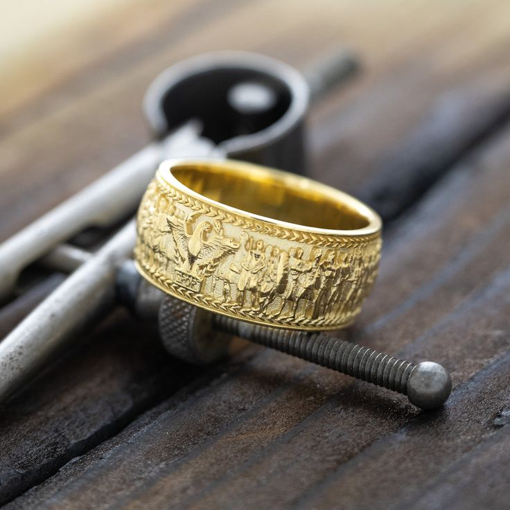 Introducing our exquisite solid gold ring, a masterpiece that brings ancient Roman history to life. This unique piece features a stunning 3D depiction of Emperor Caracalla, inspired by the late 1st-century AD marble relief housed in the Palazzo della Cancelleria. On one end, you'll find the iconic Capitoline Wolf nurturing Romulus and Remus, while the other end showcases a majestic Roman eagle. Both are adorned with laurel wreaths and the revered SPQR acronym, symbolizing "the Senate and People of Rome." This ring is not just a piece of jewelry but a timeless tribute to the grandeur of Roman civilization. This ring also comes with a high quality gift box with a message engraved on the top. You can write what you would like engraved in the notes section when checking out or personalization Byzantine Style Yellow Gold Jewelry For Anniversary, Fine Jewelry Engraved Yellow Gold Ring For Ceremonial Occasions, Heirloom Yellow Gold Carved Engraved Ring, Heirloom Carved Gold Rings, Heirloom Style Carved Gold Rings, Carved 14k Gold Jewelry, Ceremonial 14k Gold Jewelry With Decorative Band, 14k Gold Jewelry With Decorative Band For Ceremonial Occasions, Ceremonial Yellow Gold Jewelry With Decorative Band