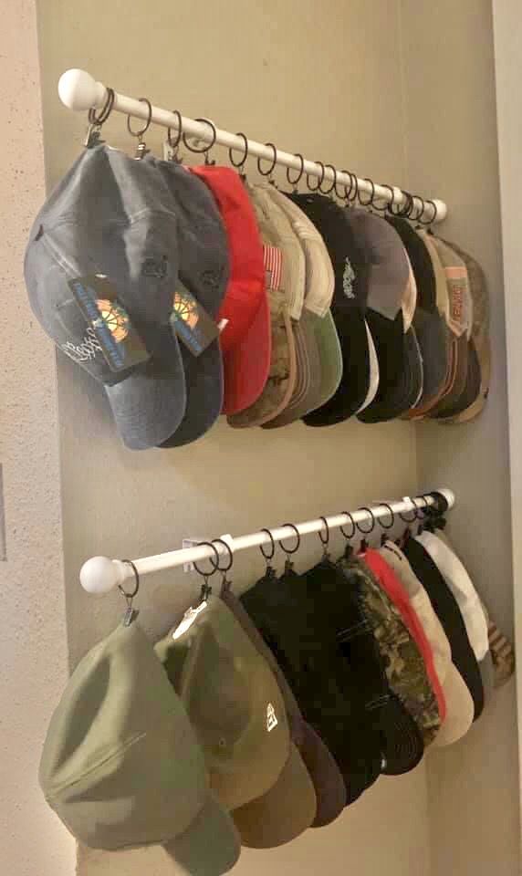 several hats are hanging on the wall