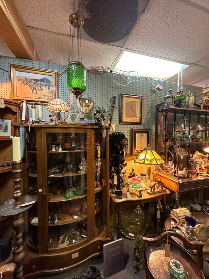 a room filled with lots of furniture and antiques