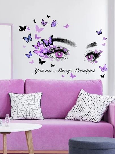 a living room with pink couches and butterflies on the wall above it that says you are always beautiful