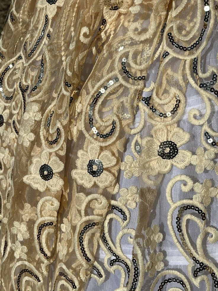 Beautiful Embroidery Cream beige color lace with gold sequined flowers. Eco- Friendly. Breathable. Good quality. Condition is new. Width 50”., sold by 1yard. Festive Beige Embroidered Fabric With Intricate Details, Beige Embroidered Lace Fabric For Party, Embroidered Cream Sequin Lace Fabric, Cream Embroidered Lace Sequin Fabric, Beige Lace Embroidered Fabric For Party, Gold Lace Sequin Fabric With Lace Work, Festive Embellished Lace Embroidered Fabric, Festive Beige Dupatta With Lace Work, Cream Embellished Lace Sequin Fabric