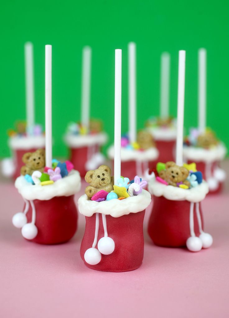 small cupcakes decorated with teddy bears and candles