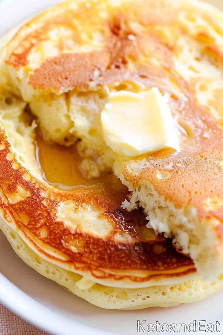 pancakes with butter and syrup are on a plate, ready to be eaten or eaten