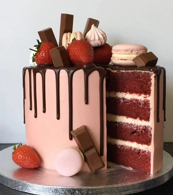 a cake with chocolate icing and strawberries on top