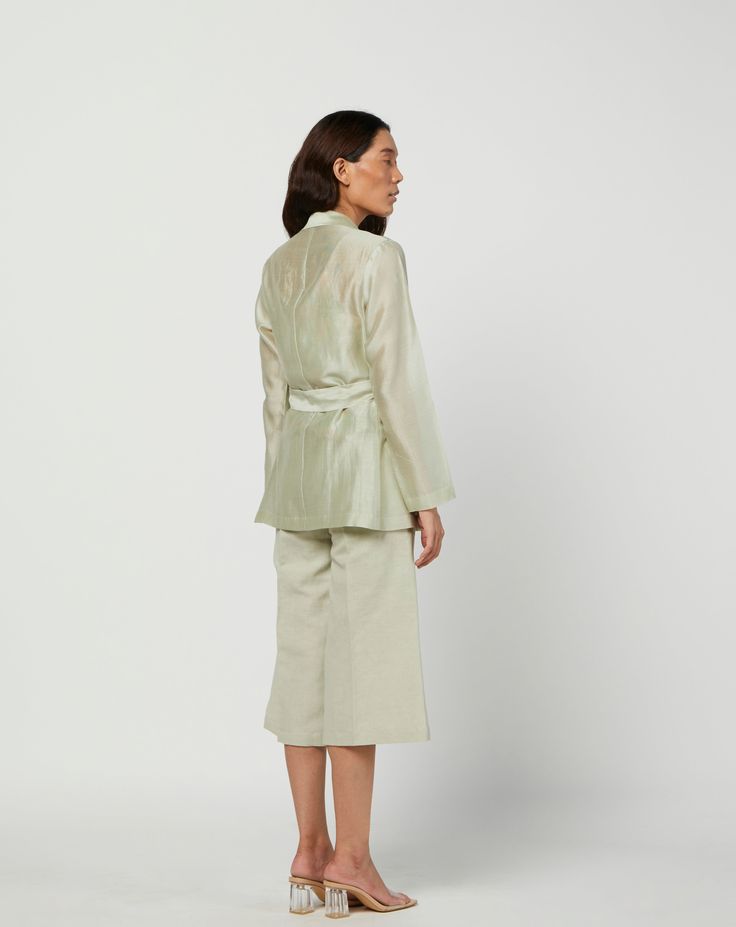 Editor's Note Featuring a green moss silk jacket in silk chanderi and s linen pants with lining. Color: Green Fabric: Silk Chanderi; Linen; Cotton Voile Lining Care: Dry Clean Only Customize Your Outfit Can't find the size you're looking for? No stress. Just select the size "Custom" while adding the item to your cart. We will follow up with you for your body measurements. To request a color or design customizations, please contact our customer care by using our "Ask us a question" form or simply Green Silk Workwear Sets, Elegant Green Silk Outerwear, Green Silk Outerwear For Spring, Green Silk Sets For Spring, Spring Silk Pantsuit For Workwear, Silk Sets For Workwear In Fall, Spring Formal Nehru Jacket, Spring Silk Formal Pantsuit, Fall Silk Sets For Workwear