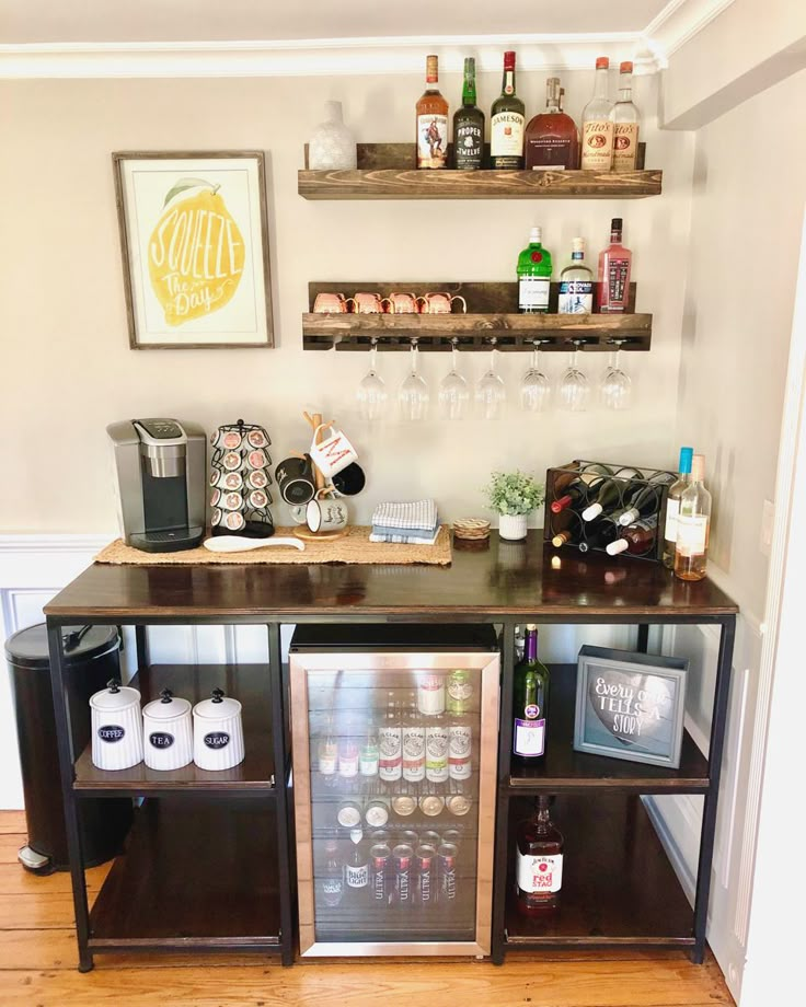 a small bar with bottles and glasses on it