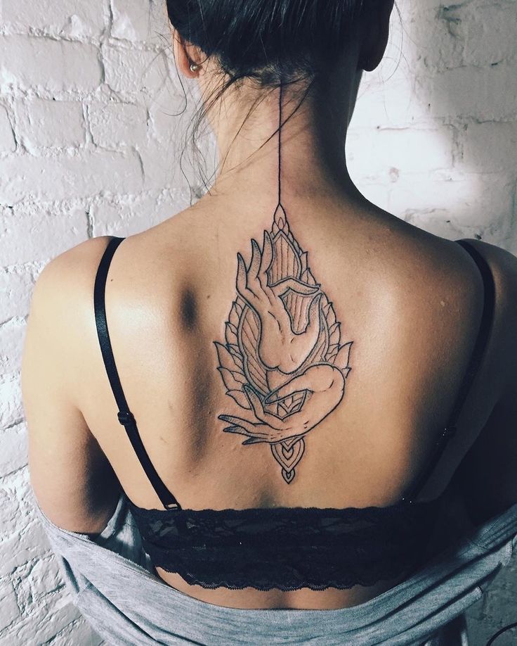 a woman with a tattoo on her back