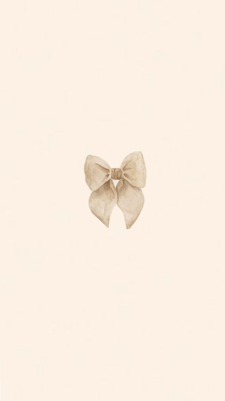 an image of a white bow on a beige background with space for text or photo