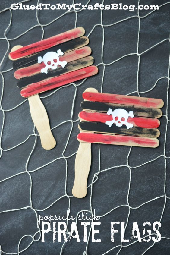 two popsicle pirate flags are sitting on a net