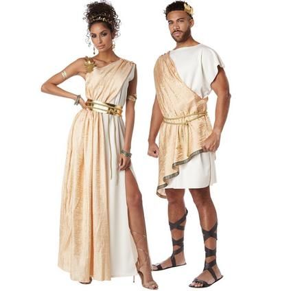 two people dressed in roman costumes standing next to each other with their hands on their hipss