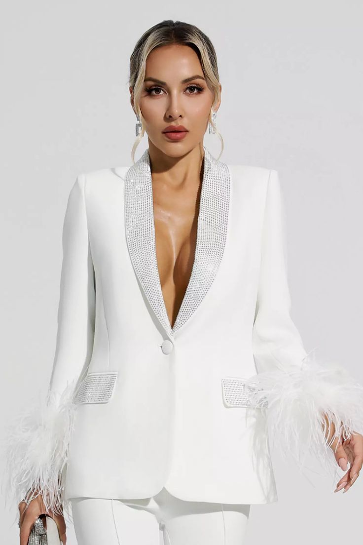 An elegant statement with a fashion-forward feel is our Angel White Feather Diamond Blazer Set. Exquisite suit fabric and detailed tailoring bring you a comfortable experience. Trimmed with ostrich feathers and embellished with hot diamonds, it has a fitted silhouette that adds elegance. Whether it's work or a midnight party, wear this set and you're sure to get compliments from everyone.  Top Length: Approx 70cm Pants Length: Approx 105cm Materials: Polyester Gentle Dry Clean Only  The model is Seniors 2024, Silver Sequin Top, Vegas Birthday, Glitter Wedding Dress, As You Like It, Silhouette Photography, Total White, Brand Photoshoot, Chic Blazer