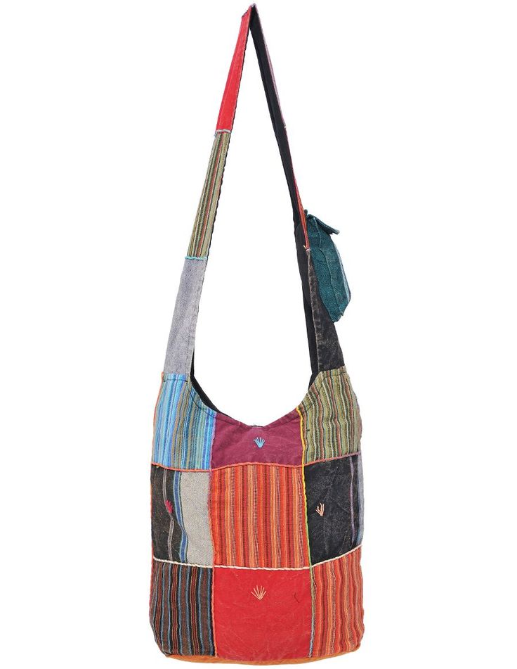 Tote your essentials in boho hippie style with this bold cotton handbag that will add a splash of flash to multiple ensembles. Each bag has its own order of patterns, and colors, but each style looks essentially like the picture displayed. Made in Nepal Fair Trade 100% Cotton Lined interior with side pocket Top zipper and button fastener Approximate Bag Size: 14" x 3.5" x 13" Shoulder Strap Length: 22" Boho Hippie Style, Cotton Handbag, Style Looks, Pocket Top, Hippie Style, Picture Display, Pocket Detail, Side Pocket, Boho Hippie