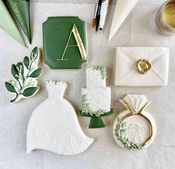 wedding decorations and cookies are laid out on the table